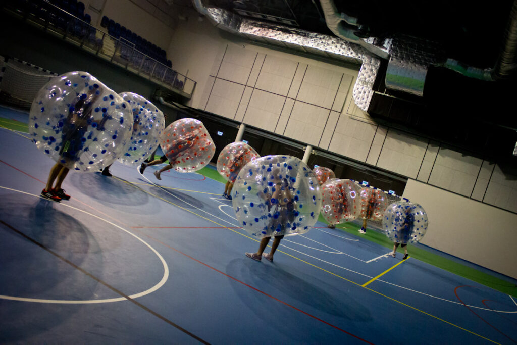 Players colliding in inflatable bumper balls