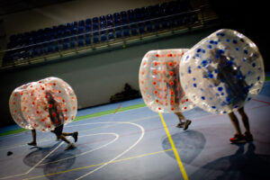 Bumper Ball match in a hall – players colliding