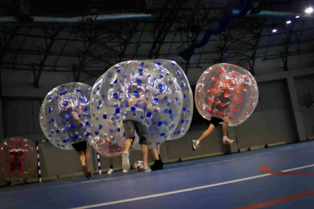 Players colliding in inflatable bumper balls