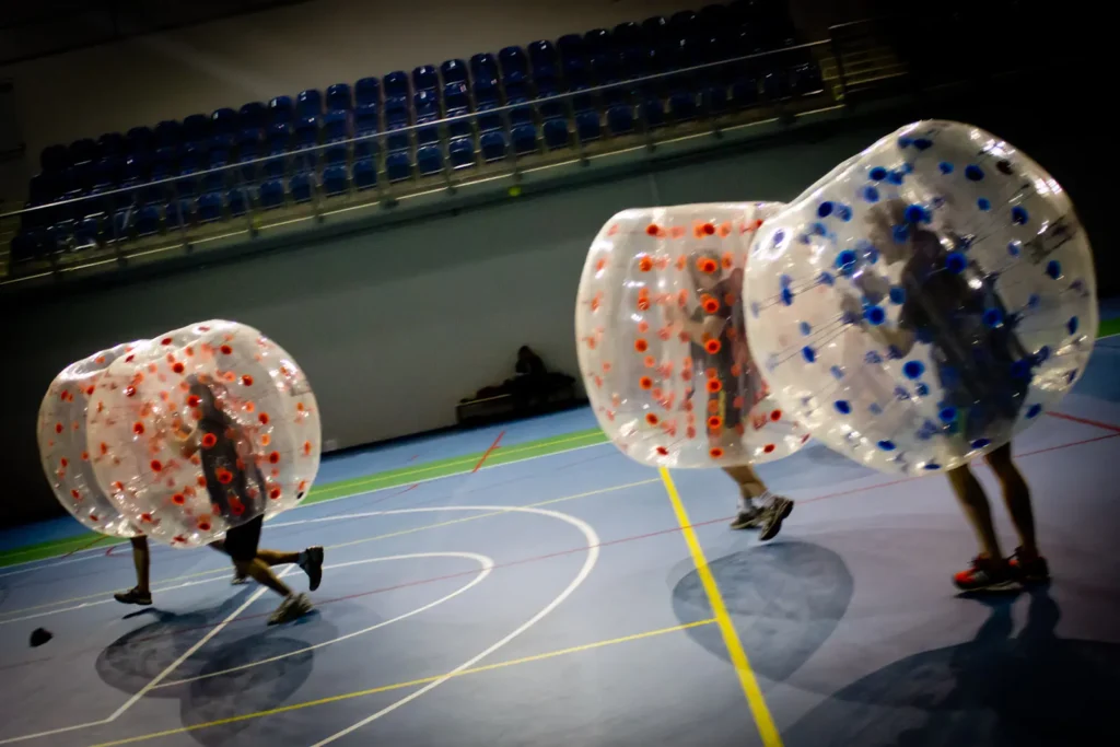 Players colliding in inflatable bumper balls
