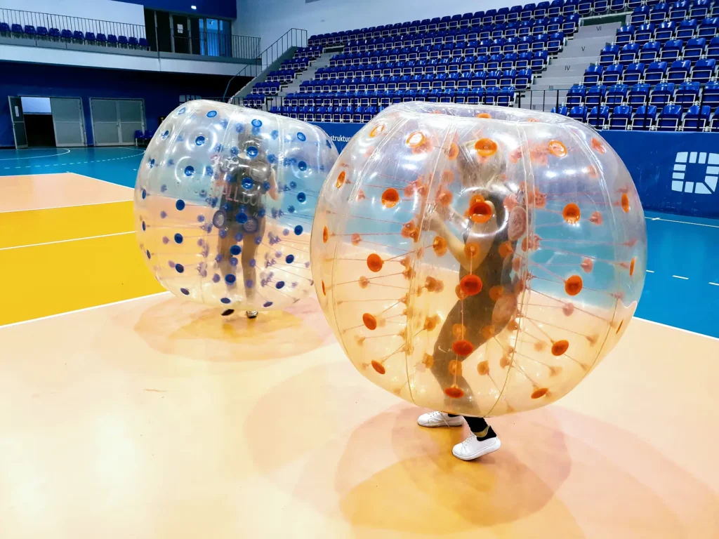 Players colliding in inflatable bumper balls