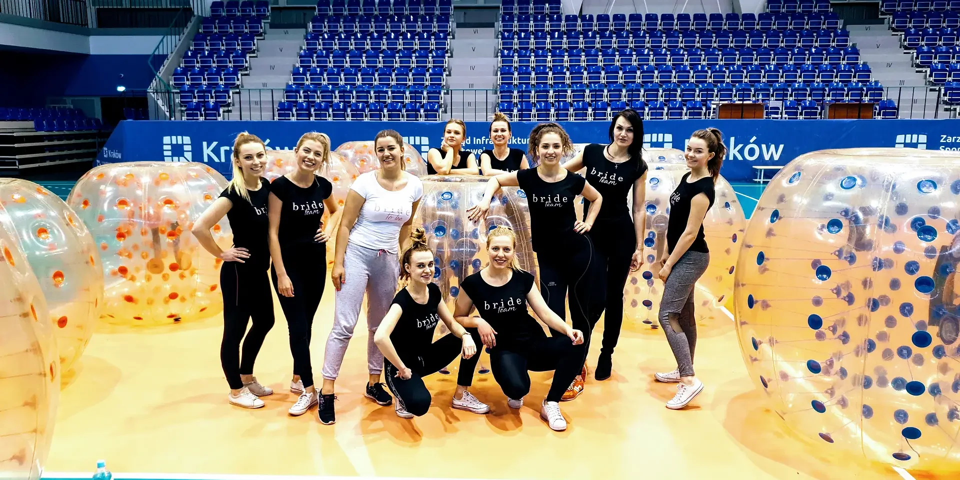 A group of women with bumper balls in a sports hall in Krakow