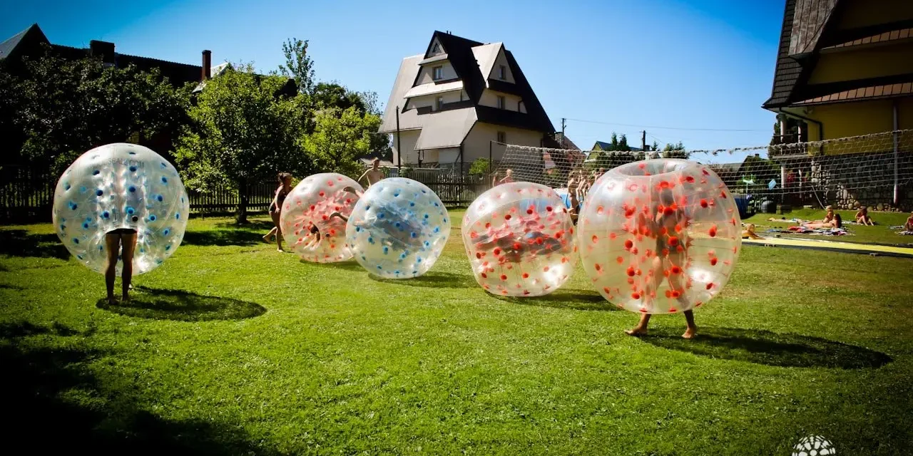 Bumper ball match on grass outdoors