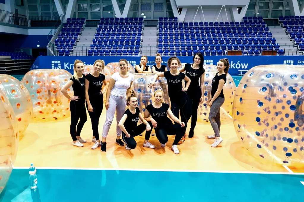 A group of women with bumper balls in a sports hall in Krakow